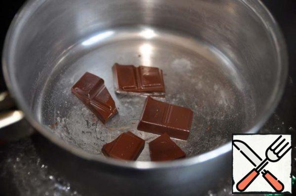 Take any favorite chocolate and heat in a saucepan in a water bath.