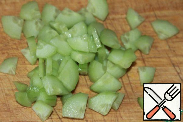 Cucumber peel and finely chop.