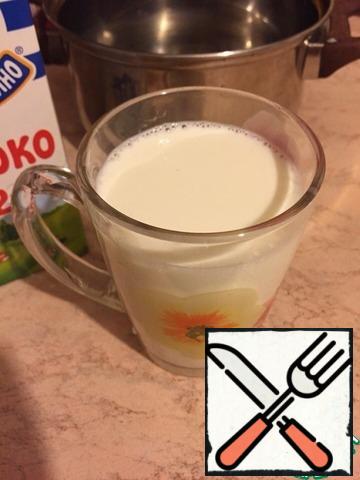 Pour into a mug of milk and put in the microwave for 1.5-2 minutes;