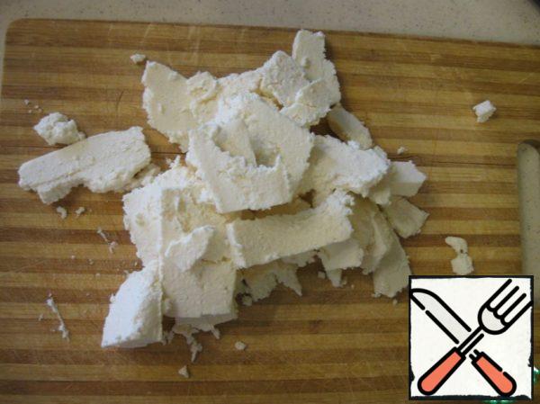 Cut the cheese into pieces (Adygei cheese falls apart when slicing, so my pieces are not very attractive).