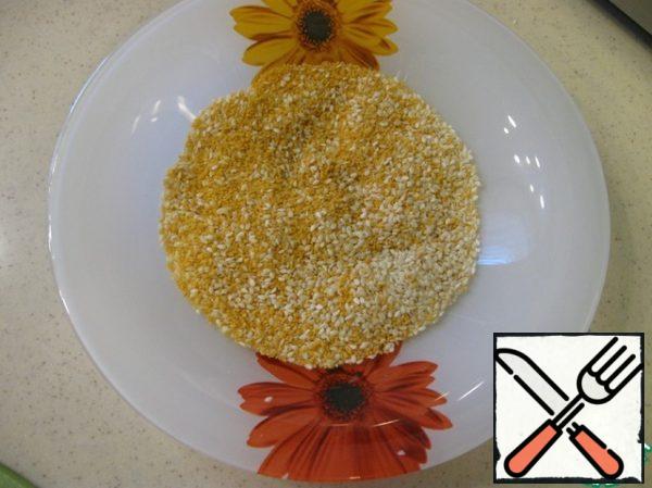 Pour the breadcrumbs on a plate.
