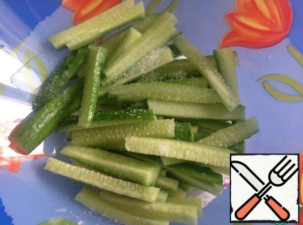 Cucumbers cut into cubes, add salt.
