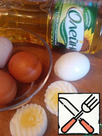 Boil eggs hard. Clean, cut across into two halves.