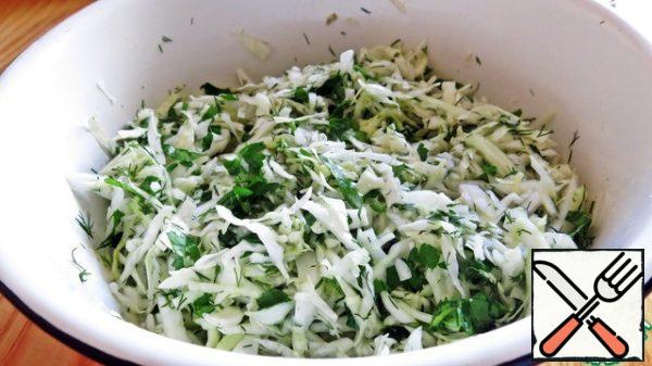 Cabbage and greens and sprinkle lightly with salt and mash with hands, that cabbage gave juice.