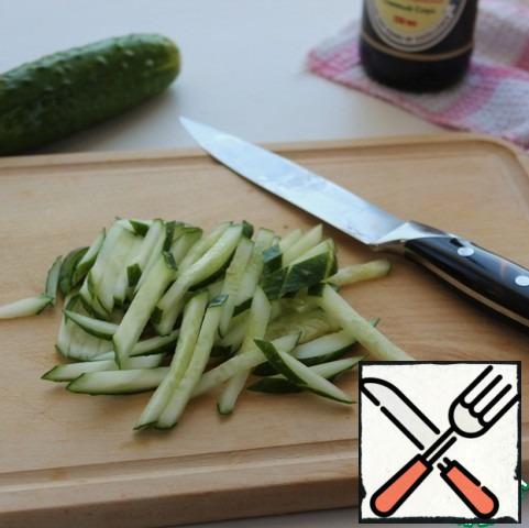 Fresh crispy cucumbers cut into strips.