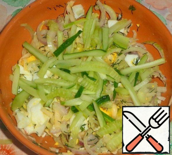 Cucumber cut into strips and add to the salad.