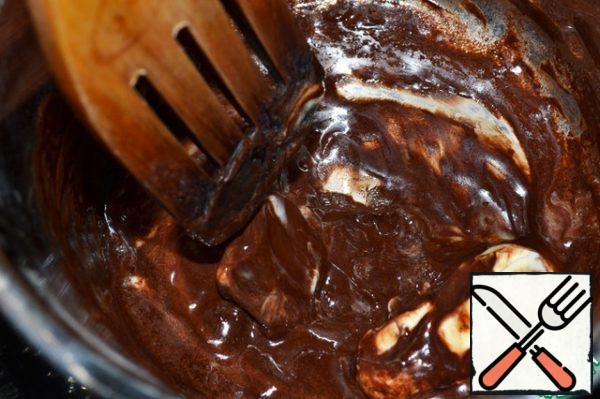 Melt the chocolate and butter in a water bath.
