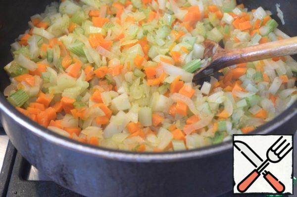 Fennel, onions and carrots stew in a small amount of olive oil until soft.