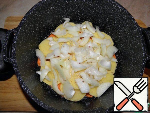 Further, the potatoes lay randomly chopped onion.