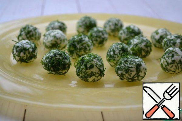 Finely chop the greens, roll the cheese balls in it.

