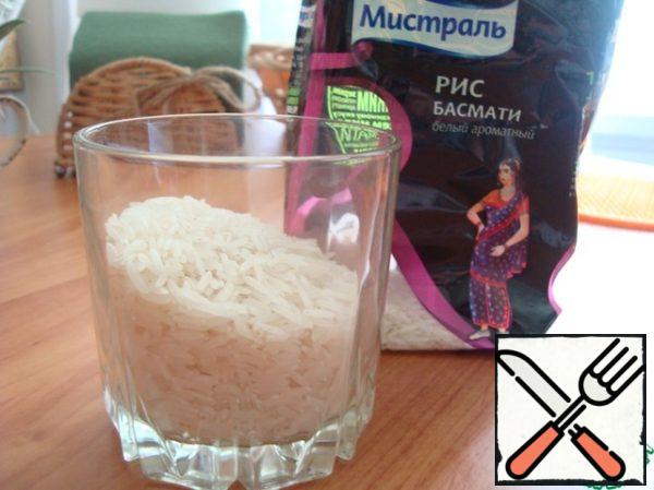 Boil rice in slightly salted water in the ratio: 1 Cup of rice to 2 cups of water. Boil until water is completely absorbed.