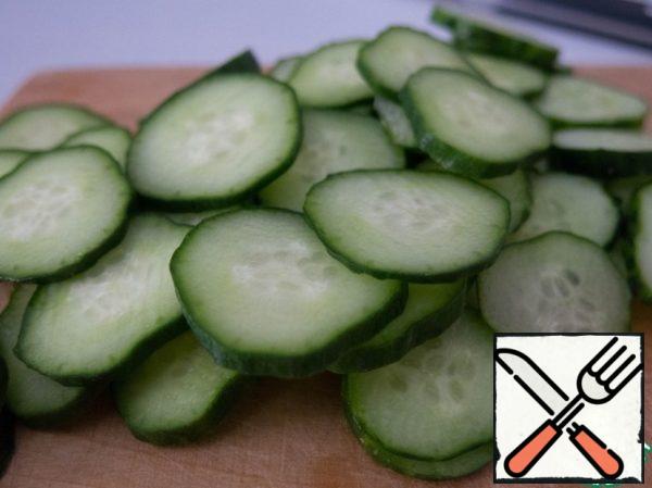 Cut rings cucumbers, or smaller, depends on size.
