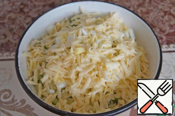 Then cut into small cubes or grated on a coarse grater cheese.