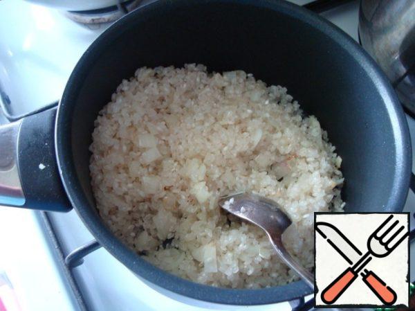Spread the rice and do, stirring until the rice is as if transparent ("glass").