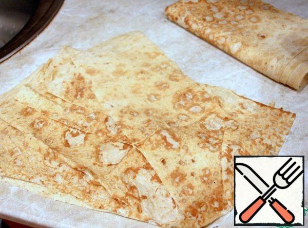 Pita bread sheet cut into several leaves the size of the baking dish, I got 7 sheets (form 30x10 cm, height 7 cm)