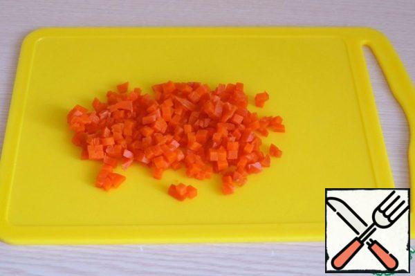 Carrots boil, cut into small cubes.