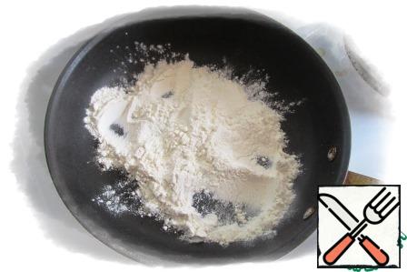 In a dry frying pan fry the flour until yellowing and the appearance of a distinct aroma.