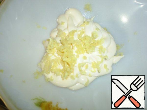 In mayonnaise add squeezed through press garlic, stir.