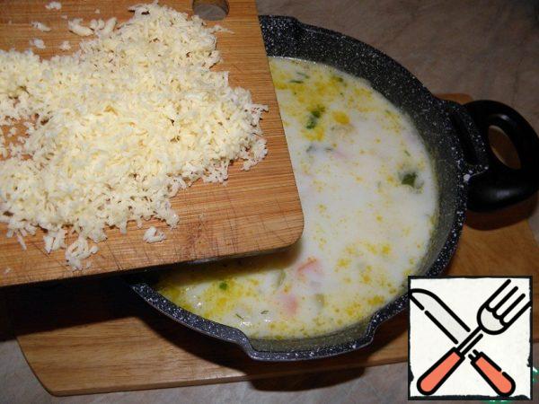 Add grated cheese (I have on a fine grater). Bring to a boil, warm up, but do not boil and turn off.