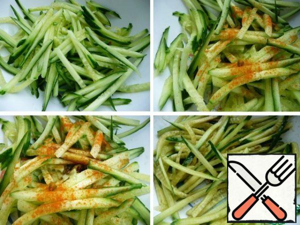 Cucumbers to grate on the Korean grater or cut into sticks.
Add red hot pepper, soy sauce, lemon juice, sugar, a little salt.
Stir.