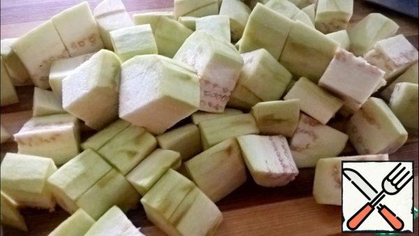 Eggplant peel and cut into large cubes.