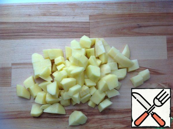 Wash, peel and finely chop the potatoes.