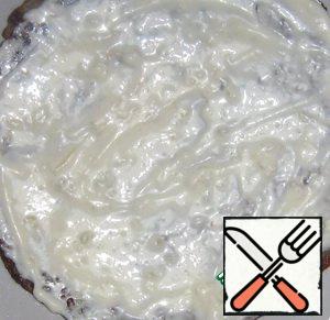 Pancakes spread with mayonnaise and garlic. Decorate with grated egg and herbs.
