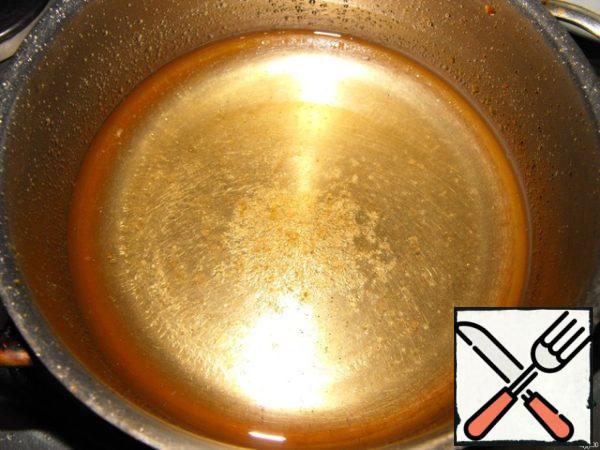 In a small saucepan pour vinegar, vegetable oil, add sugar and salt. Allow to boil and cook until dissolved salt and sugar.