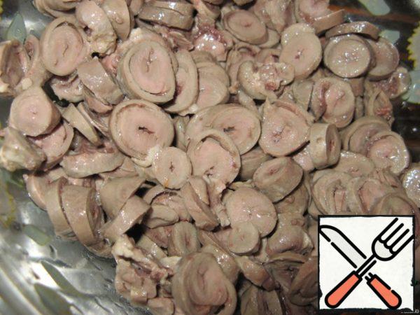 Boiled chicken hearts cut into small pieces.