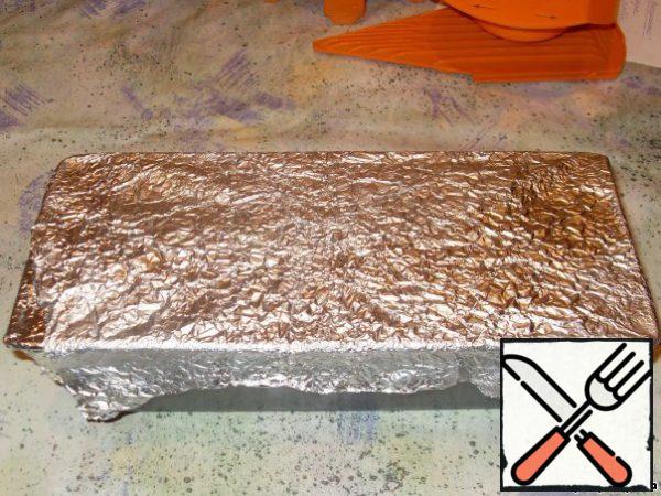 Cover the mold with foil. Put it in a deep mold with water and put it in a hot oven.
