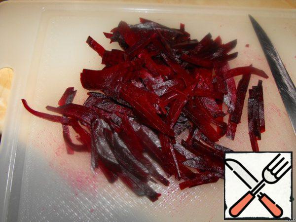 Beets cut into thin long strips.