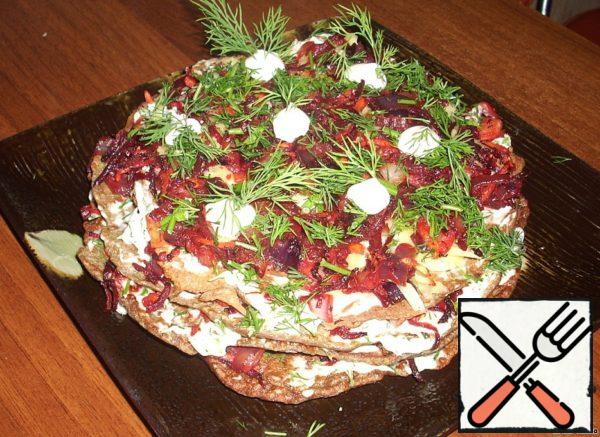 Decorate with dill, you can sprinkle grated cheese on top of hot pancakes that just melted. Enjoy the delicate garlic-sweet (beetroot) taste of a hearty festive snack. Can be served as a hot dish.