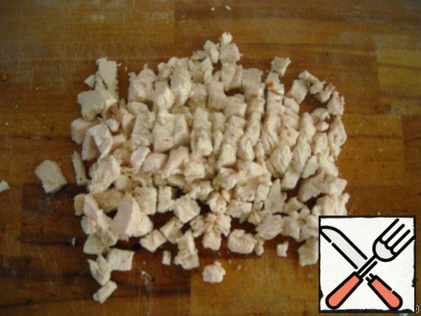Boil the chicken breast and slice it.
