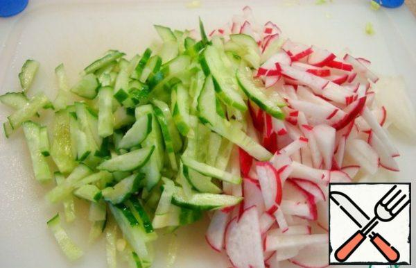 Cucumber and radish cut into thin slices.