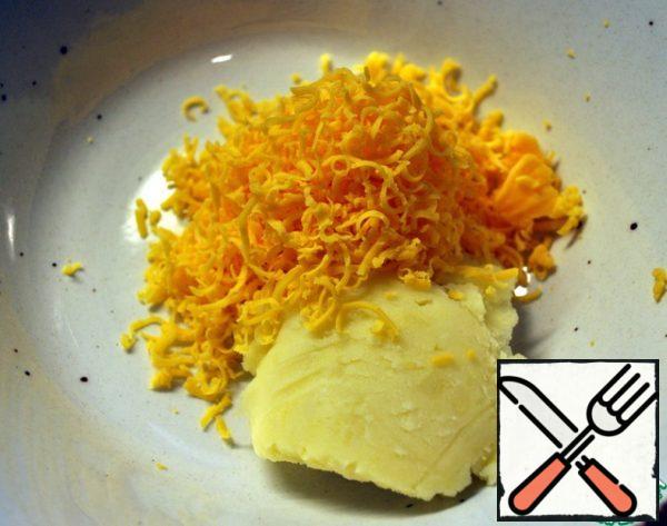 Mix mashed potatoes and grated cheese.