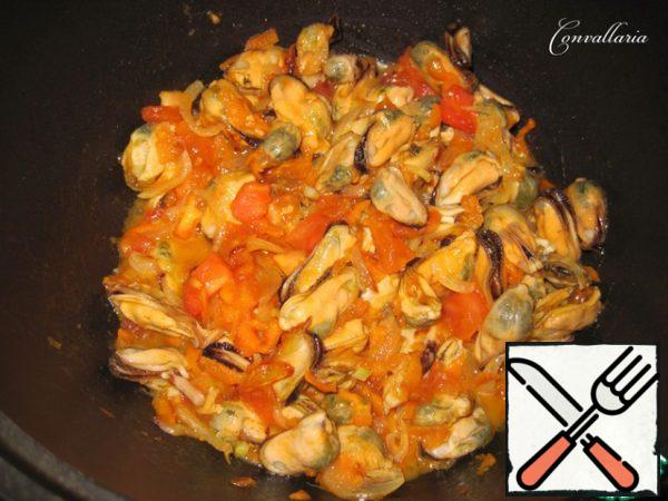 To vegetables add mussels, salt and pepper to taste.