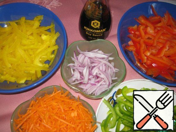 Peppers cut into very thin strips, carrots grate on the Korean grater, onion cut into strips.
