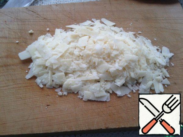 Parmesan cut with a knife or grate.