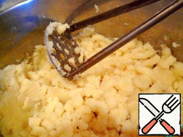 Boil potatoes, drain, mash with pestle or blender.