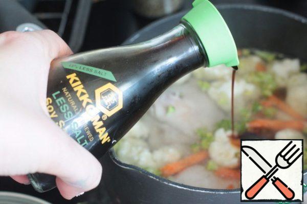 In the boiling broth to cover vegetables and add low salt soy sauce. Cook until soft carrots (about 5-7 minutes).