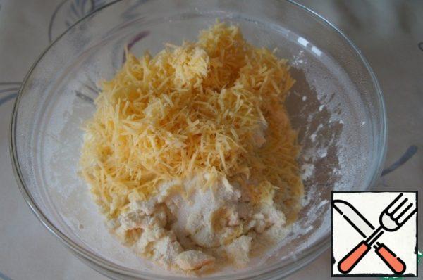 Then add the cheese grated on a fine grater (2 tablespoons to set aside), mix again.