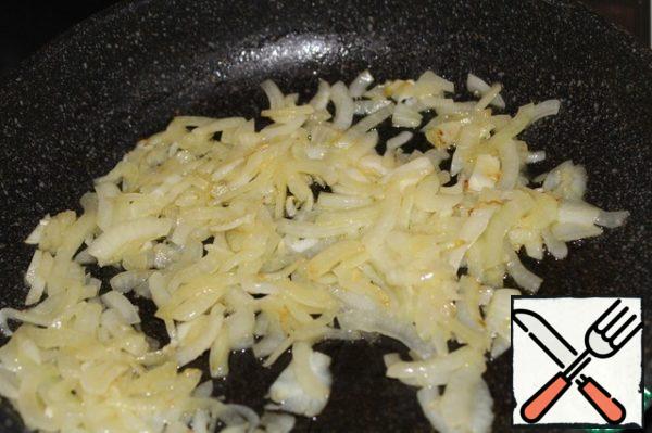 Heat olive oil and one tablespoon of butter in a frying pan and fry the onions until Golden.