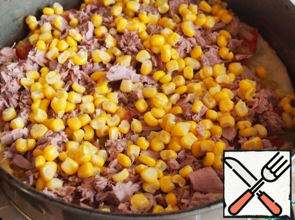 Add canned tuna (remove liquid) and canned corn (also without liquid).