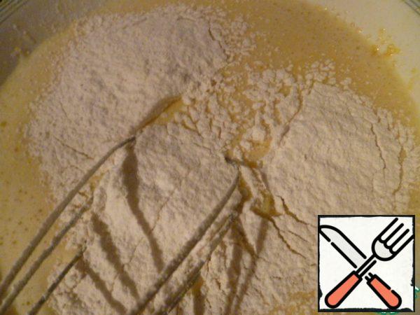 Then add the sifted flour and mix well.