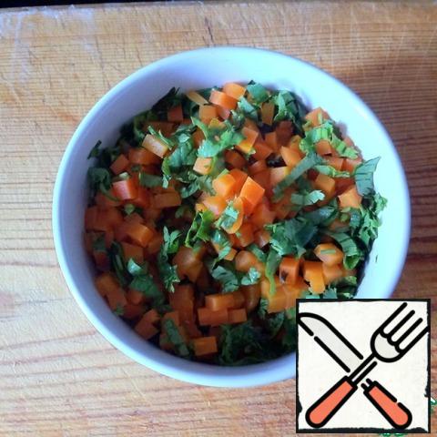 Carrots are boiled until half cooked. Cut into small cubes, mix with chopped cilantro. Salt and pepper to taste.