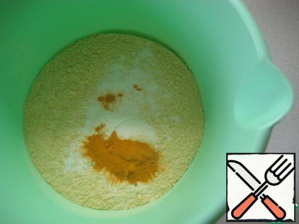 In a separate bowl combine corn flour, turmeric and baking powder dough.