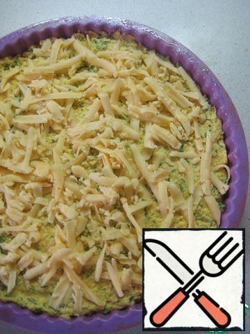 In a greased form of vegetable oil spread the dough, level and sprinkle with the remaining grated cheese.Bake in a preheated 200 degree oven until Golden brown, about 20-25 minutes.Remove, allow to cool down.