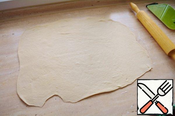 Now roll it thinly (about 3-4 mm) and preferably try to form a rectangular layer.