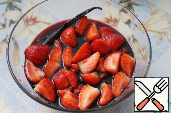 Add balsamic vinegar and strawberries to the almost cooled syrup.
