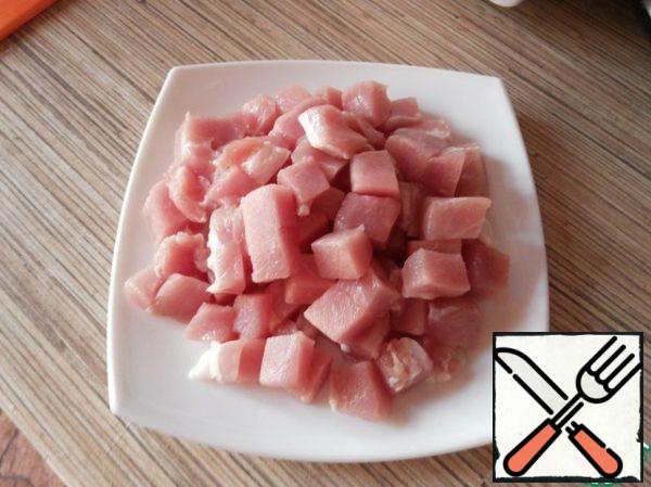 Cut pork into cubes.
